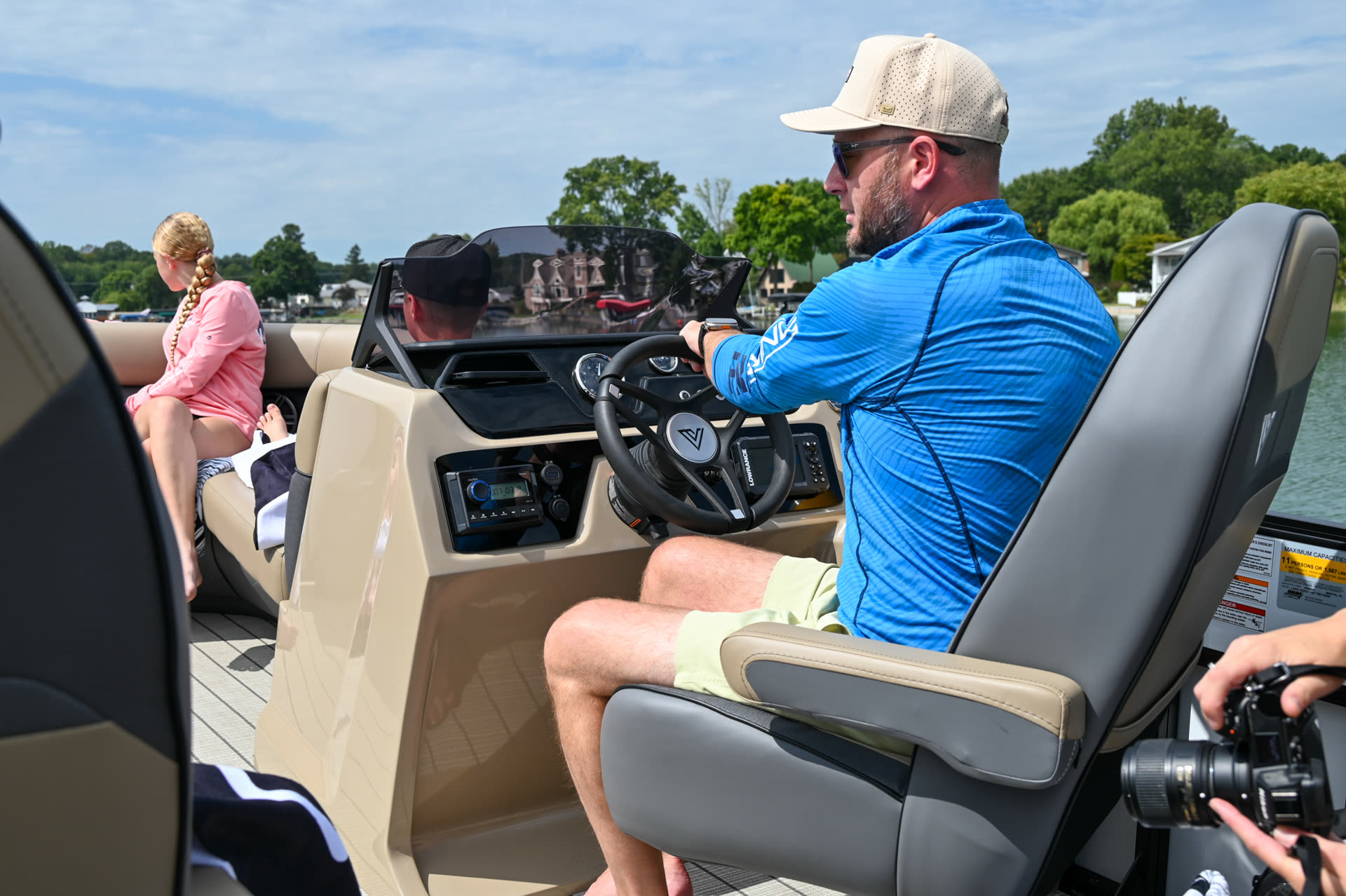 Renter at the helm of a Big Thunder tritoon with family aboard at Lake of the Ozarks